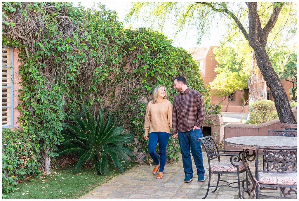 couple walking and holding hands on patio at Rancho Manana