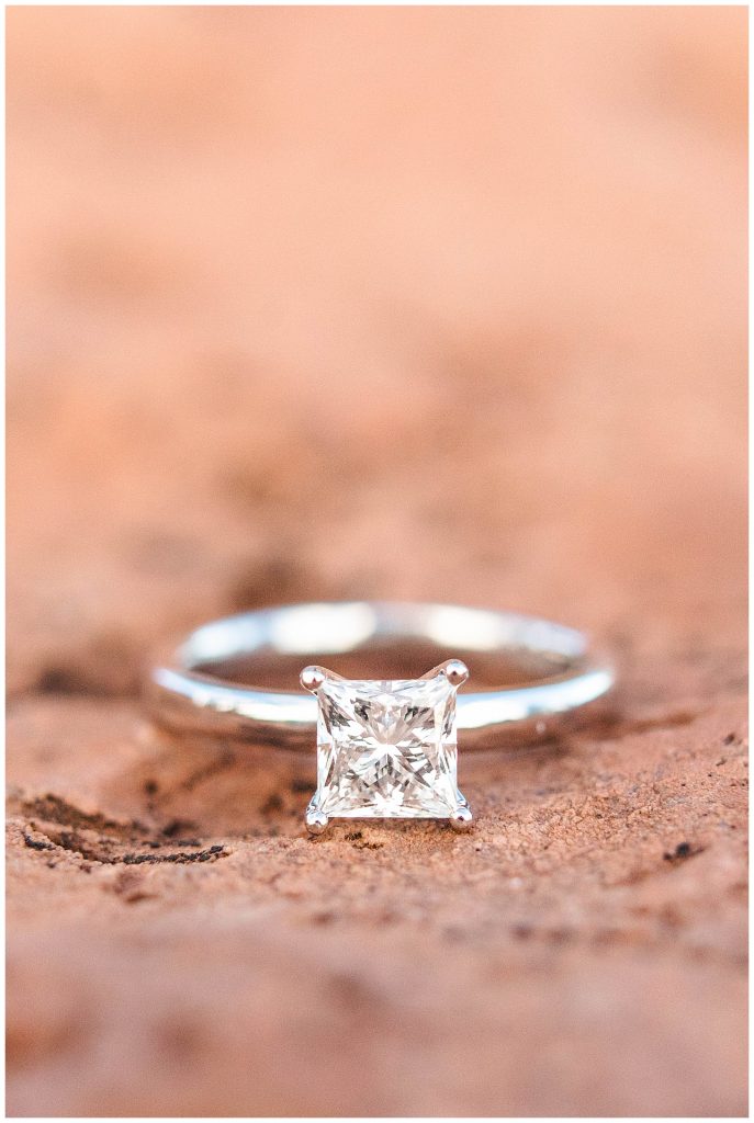 Square cut engagement ring on red rock in Sedona