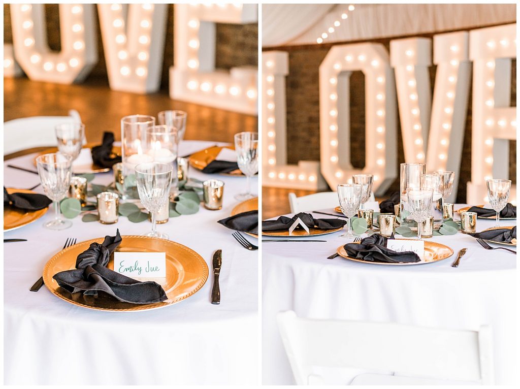 Gold and black table setting with love marquee letters